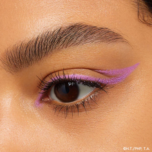 Eye look featuring bold purple gel liner.